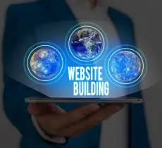 A person in a blue suit holds a smartphone displaying glowing icons of Earth with the text "Website Building" prominently featured.
