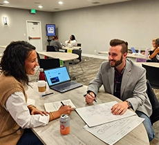 Max at CBIC Seminar Session talking to client